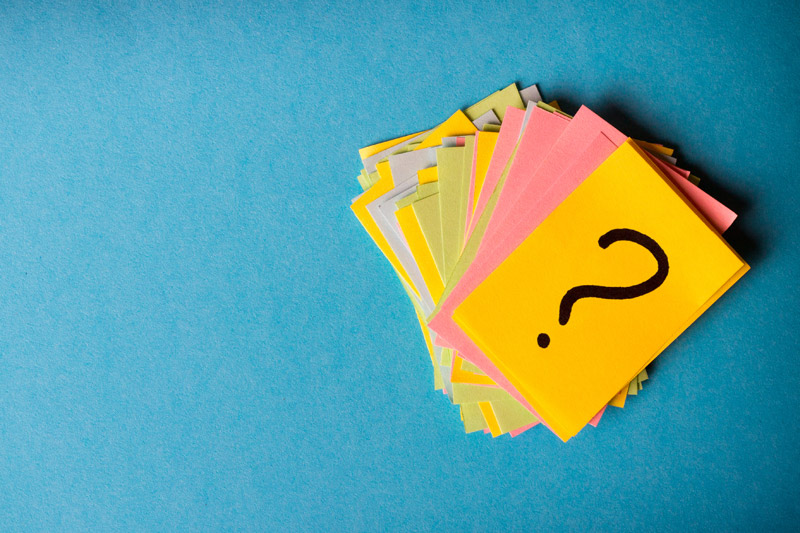 Photo of colorful notecards with a question mark written on them