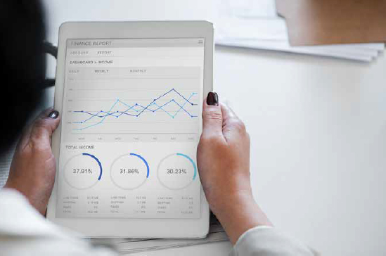 Photo closeup of a person looking at data visualisation on a tablet